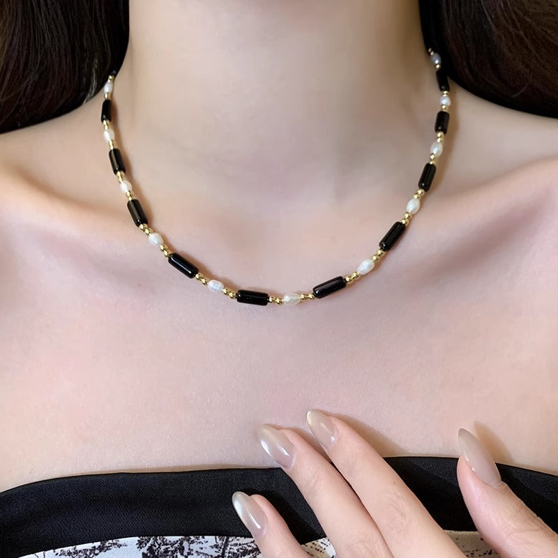 Rice grain freshwater pearl long black agate necklace, women's light luxury, cold wind, niche collarbone chain, black and white contrasting necklace