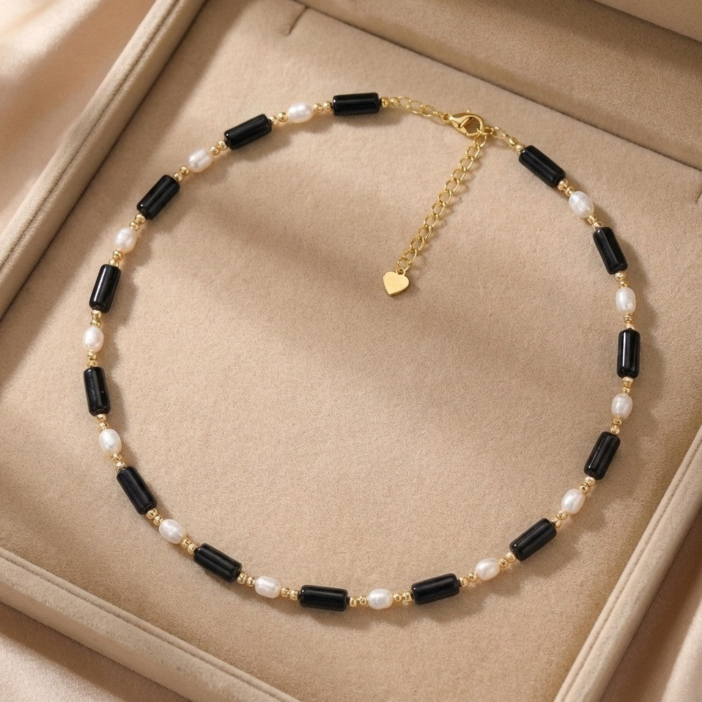 Rice grain freshwater pearl long black agate necklace, women's light luxury, cold wind, niche collarbone chain, black and white contrasting necklace
