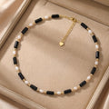 Rice grain freshwater pearl long black agate necklace, women's light luxury, cold wind, niche collarbone chain, black and white contrasting necklace