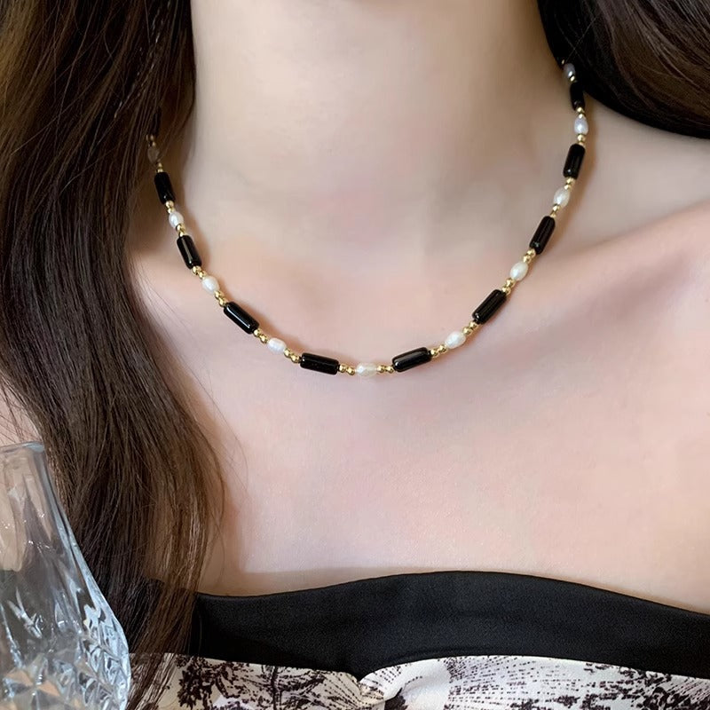 Rice grain freshwater pearl long black agate necklace, women's light luxury, cold wind, niche collarbone chain, black and white contrasting necklace