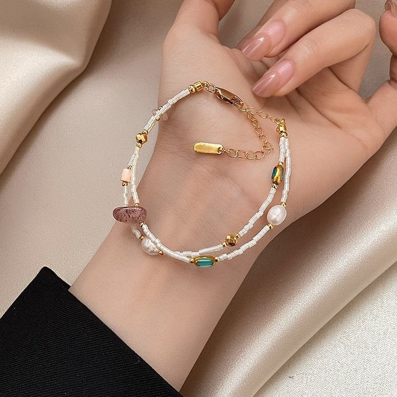 Double-layer freshwater pearl strawberry quartz millet bead bracelet for women, light luxury, niche fashionable blue crystal bracelet