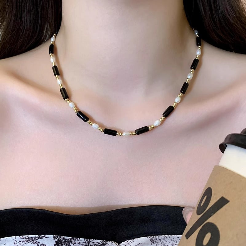 Rice grain freshwater pearl long black agate necklace, women's light luxury, cold wind, niche collarbone chain, black and white contrasting necklace